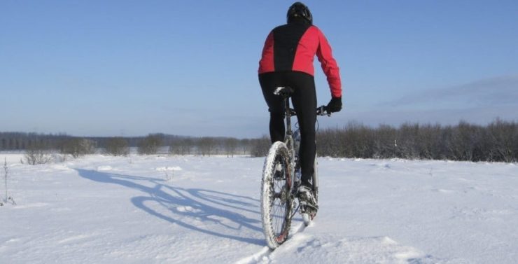 riding mountain bike in snow